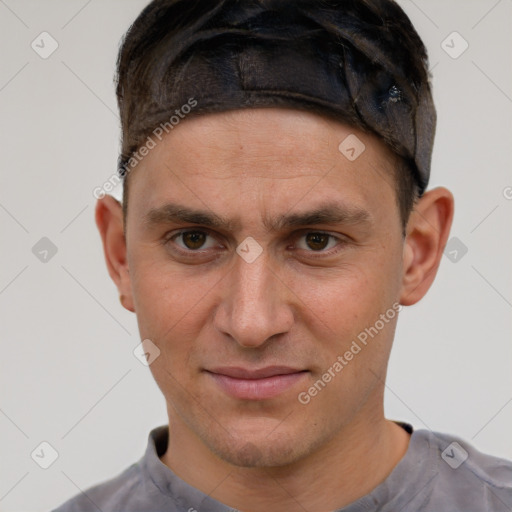 Joyful white adult male with short  brown hair and brown eyes