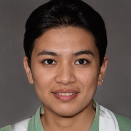 Joyful asian young-adult female with short  brown hair and brown eyes