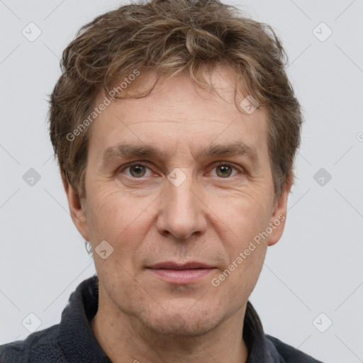 Joyful white adult male with short  brown hair and grey eyes