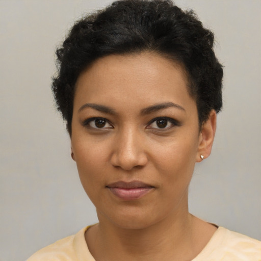 Joyful asian young-adult female with short  black hair and brown eyes