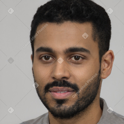 Neutral black young-adult male with short  black hair and brown eyes