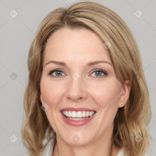 Joyful white young-adult female with medium  brown hair and blue eyes