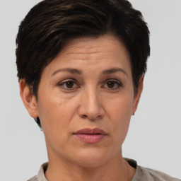 Joyful white adult female with short  brown hair and brown eyes