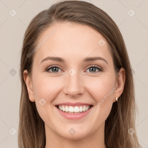 Joyful white young-adult female with long  brown hair and grey eyes