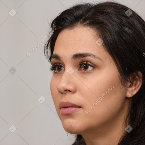 Neutral white young-adult female with long  brown hair and brown eyes