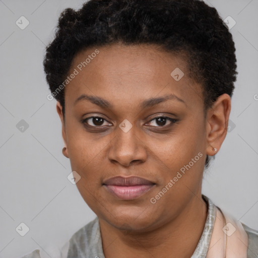 Joyful black young-adult female with short  brown hair and brown eyes