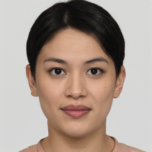 Joyful asian young-adult female with short  black hair and brown eyes