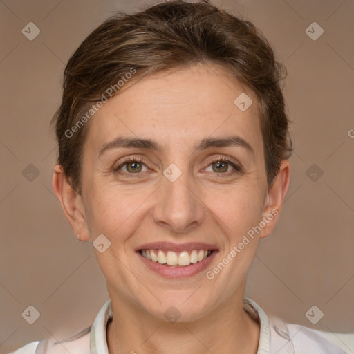 Joyful white adult female with short  brown hair and brown eyes