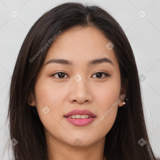 Joyful asian young-adult female with long  brown hair and brown eyes