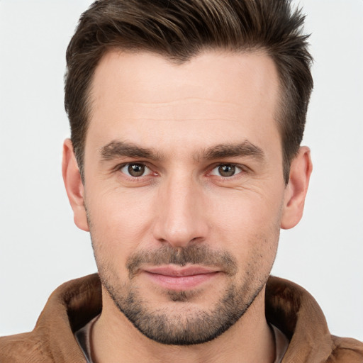 Joyful white young-adult male with short  brown hair and brown eyes