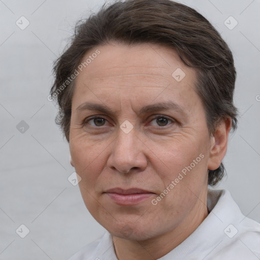 Joyful white adult female with short  brown hair and brown eyes