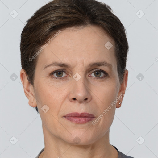 Joyful white adult female with short  brown hair and grey eyes