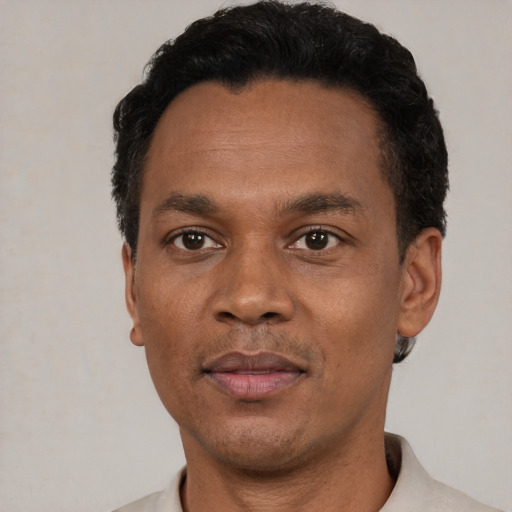 Neutral black adult male with short  black hair and brown eyes