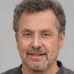 Joyful white middle-aged male with short  brown hair and brown eyes