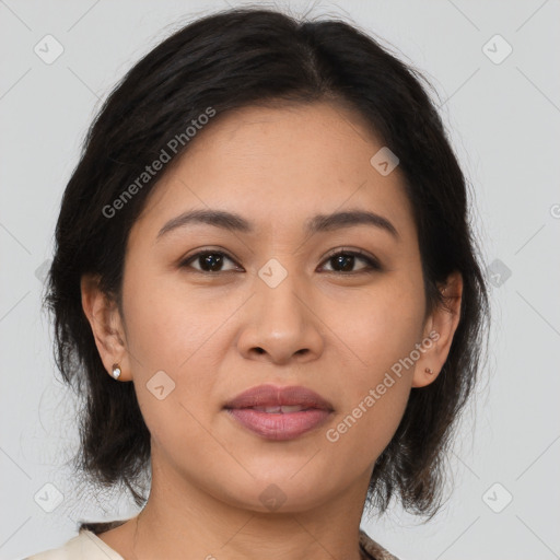 Joyful latino young-adult female with medium  brown hair and brown eyes