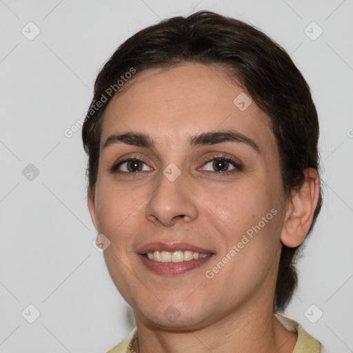 Joyful white young-adult female with medium  brown hair and brown eyes