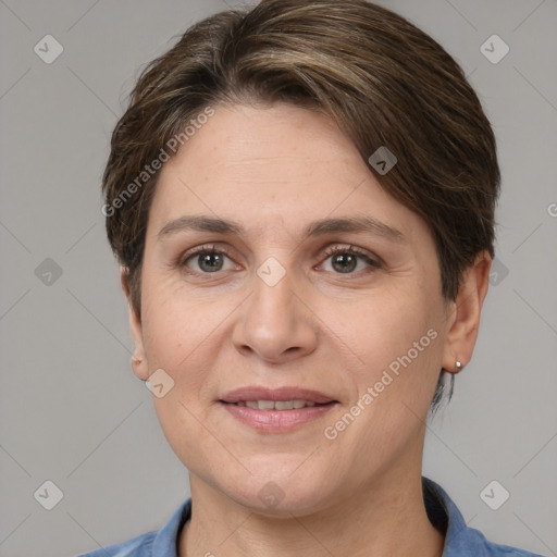 Joyful white adult female with medium  brown hair and grey eyes