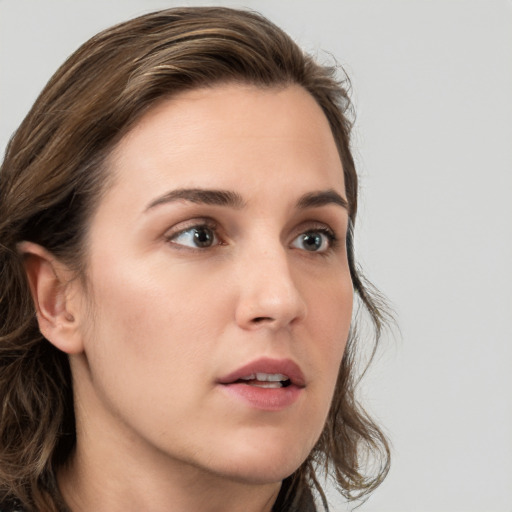 Neutral white young-adult female with medium  brown hair and brown eyes