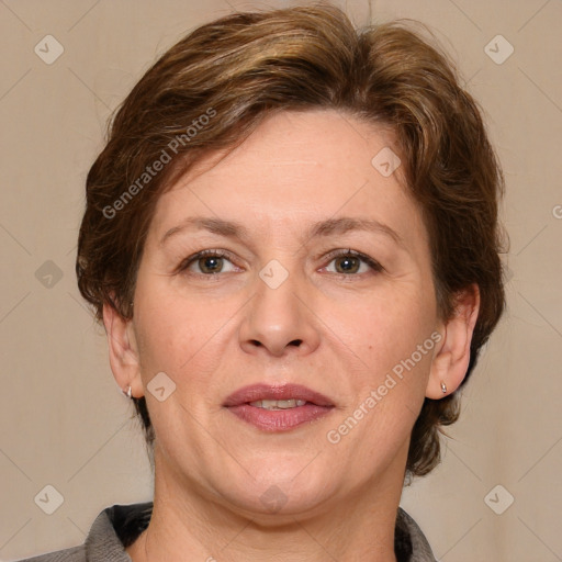 Joyful white adult female with medium  brown hair and grey eyes