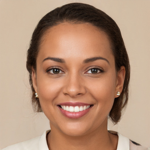 Joyful white young-adult female with medium  brown hair and brown eyes