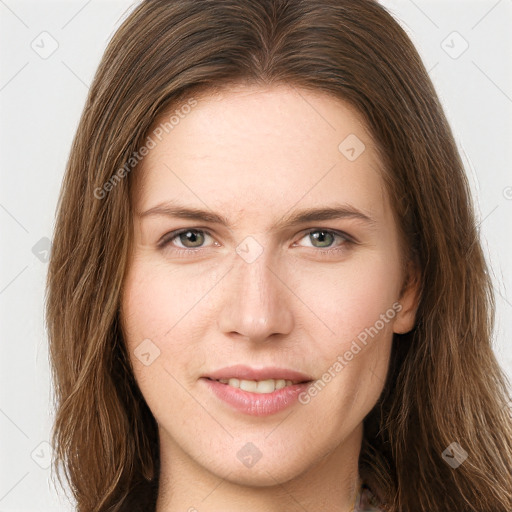 Joyful white young-adult female with long  brown hair and grey eyes