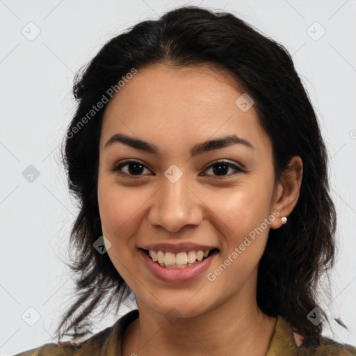 Joyful latino young-adult female with long  brown hair and brown eyes