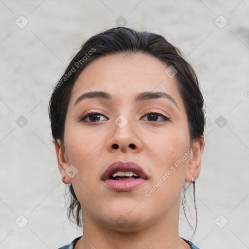 Joyful white young-adult female with short  brown hair and brown eyes