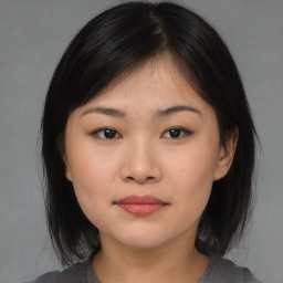 Neutral asian young-adult female with medium  brown hair and brown eyes