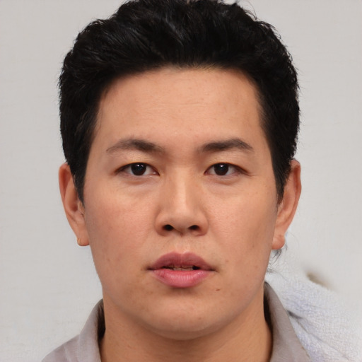 Neutral asian adult male with short  black hair and brown eyes