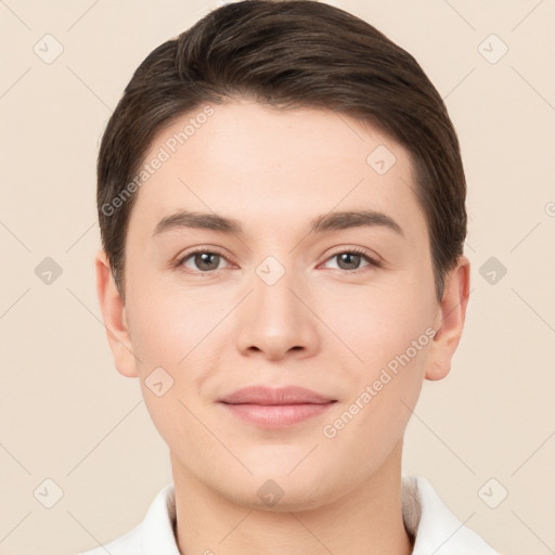 Joyful white young-adult female with short  brown hair and brown eyes