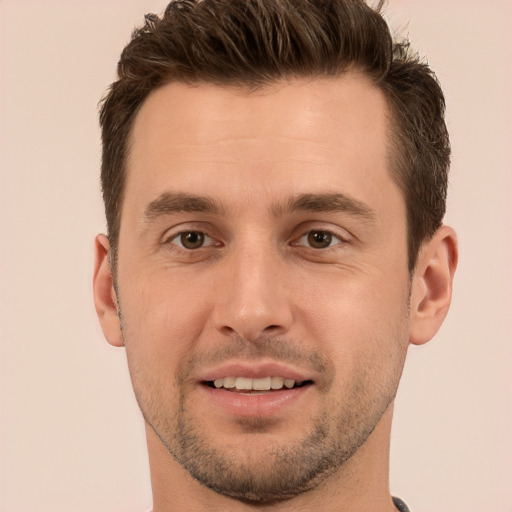 Joyful white young-adult male with short  brown hair and brown eyes