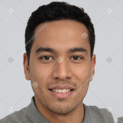 Joyful white young-adult male with short  black hair and brown eyes