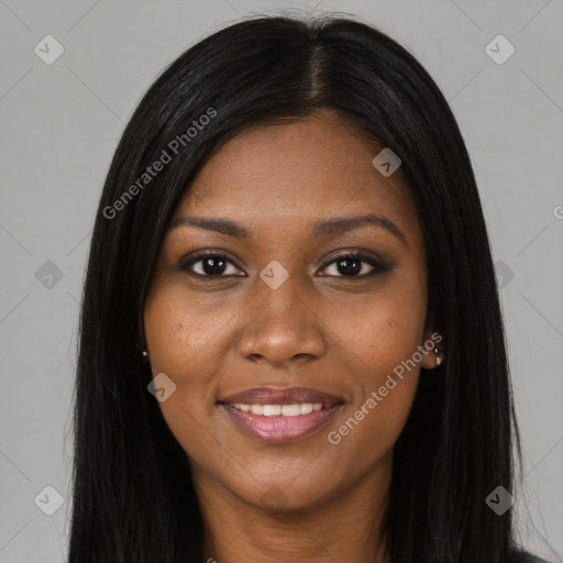 Joyful black young-adult female with long  black hair and brown eyes