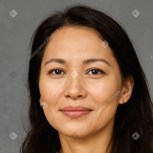 Joyful white adult female with long  brown hair and brown eyes