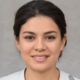 Joyful asian young-adult female with medium  brown hair and brown eyes