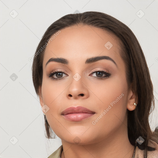 Neutral white young-adult female with long  brown hair and brown eyes