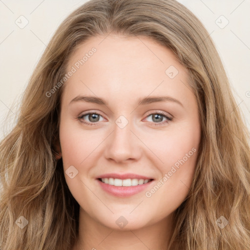 Joyful white young-adult female with long  brown hair and green eyes