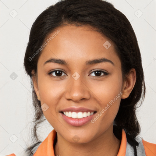 Joyful latino young-adult female with long  brown hair and brown eyes