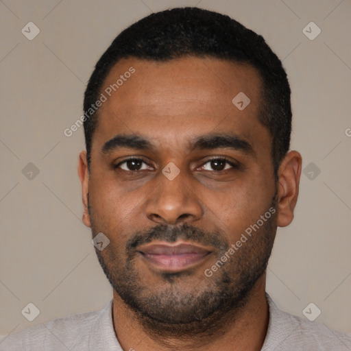 Joyful latino young-adult male with short  black hair and brown eyes