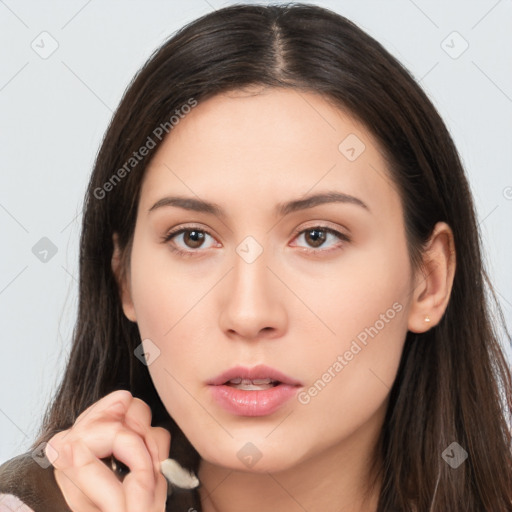 Neutral white young-adult female with long  brown hair and brown eyes