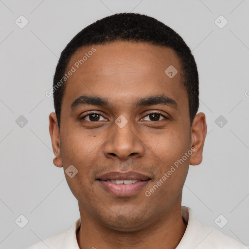 Joyful black young-adult male with short  black hair and brown eyes