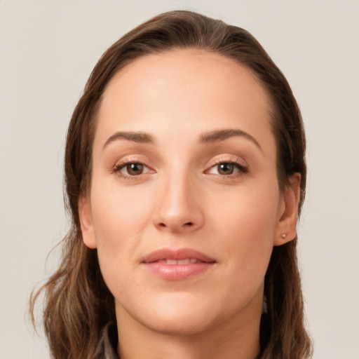 Joyful white young-adult female with long  brown hair and brown eyes