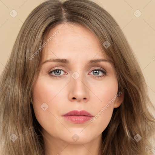 Neutral white young-adult female with long  brown hair and green eyes