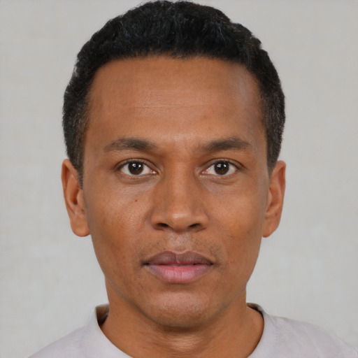 Neutral black young-adult male with short  black hair and brown eyes