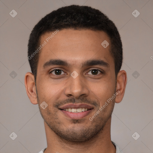 Joyful latino young-adult male with short  brown hair and brown eyes