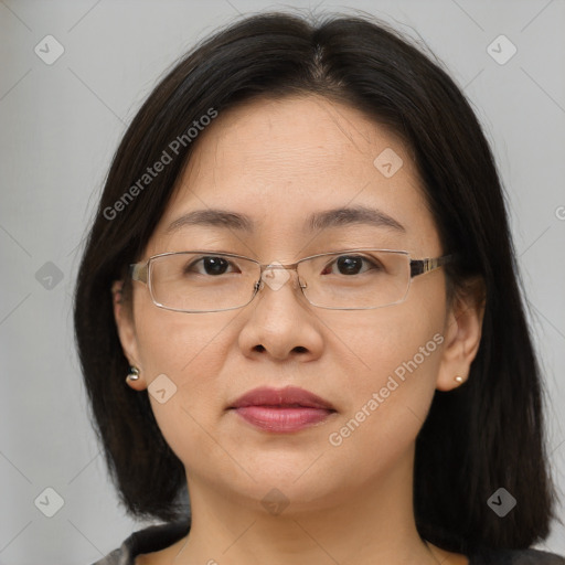 Joyful white adult female with medium  brown hair and brown eyes