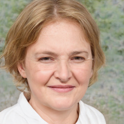 Joyful white adult female with medium  brown hair and blue eyes