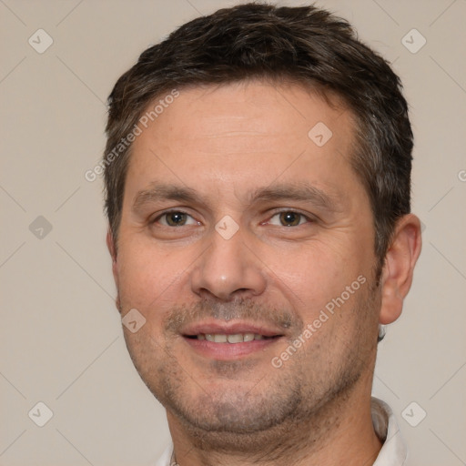 Joyful white adult male with short  brown hair and brown eyes