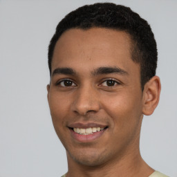 Joyful white young-adult male with short  black hair and brown eyes