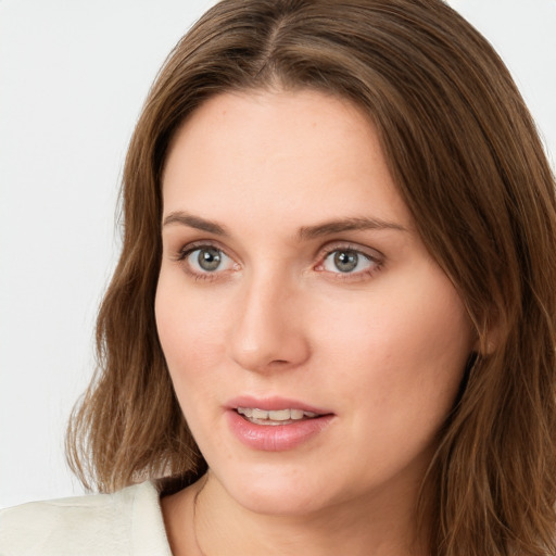 Neutral white young-adult female with long  brown hair and green eyes